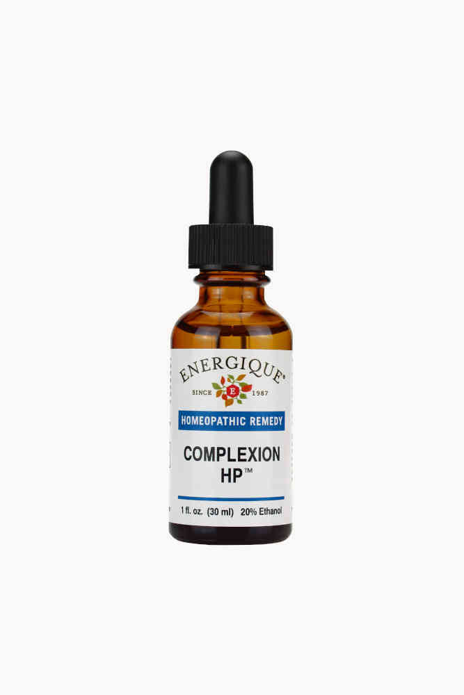 A 1 oz amber glass dropper bottle of Energique Complexion HP homeopathic remedy on a solid white background.